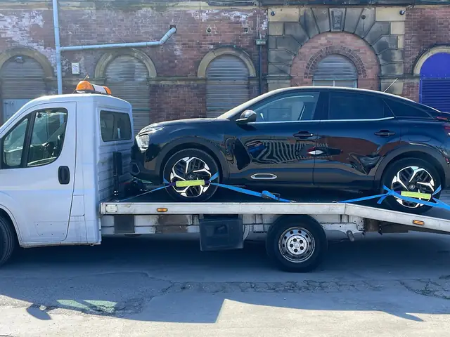 Black Citroën on the white truck
