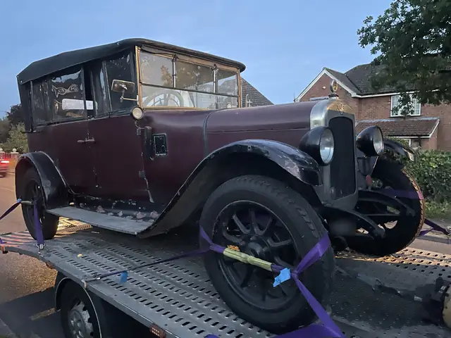 Vintage car, strapped at the wheels